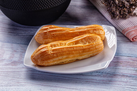 Sweet baked eclair dessert with cream