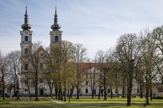Basilica of the Seven Sorrows of the Blessed Virgin Mary, a major Catholic pilgrimage site with its iconic twin towers and baroque facade, seen through a park in spring, Sastin-Straze, Slovakia