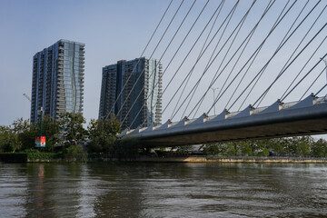 Fototapeta premium Ba Son Bridge over Saigon River with modern skyline in Ho Chi Minh City, Vietnam