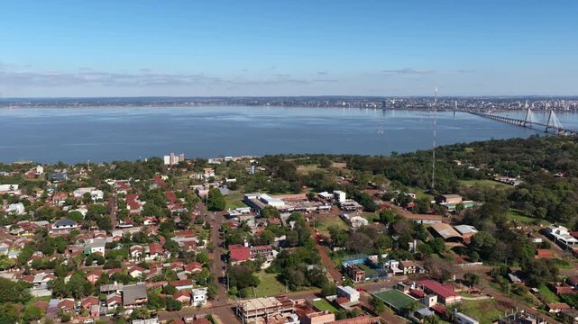 Stunning aerial footage showcasing the expansive Puente Internacional San Roque Gonz&aacute;lez de Santa Cruz, connecting bustling urban landscapes of Posadas, Argentina, and Encarnaci&oacute;n, Paraguay.