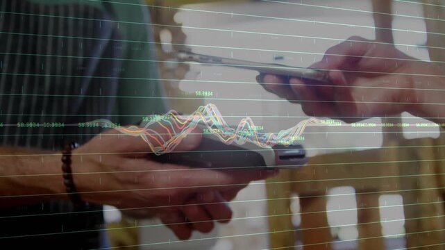 Seller holding terminal while buyer tapping smartphone, payment initiating, graph peaking, settling