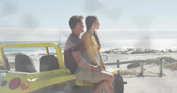 Vertical video: Wind nudging woman toward sea on buggy, man holding her, flares over couple, travel