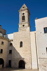 Fototapeta premium View of the ancient limestone masonry and religious structure located in the old town area of Bari under a clear blue Mediterranean sky.
