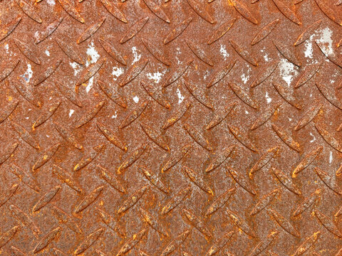 Close up of oxidized metal checker plate or tread plate. Chemical oxidation made metal color into blue. Seamless oxidized tread plate background texture