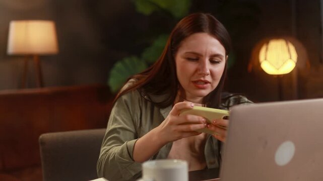 Excited Gaming And App Glitch. Person Displays Joy And Confusion During Mobile Gaming Session. Female Gamer Shows Enthusiasm And Surprise While Encountering Technical Issues On Her Device