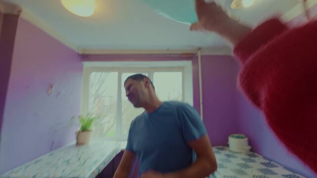 The guy angered his girlfriend and she jokingly beat him with a plastic bottle. A young married couple impulsively finds out their relationship . A funny conflict. From the first person.