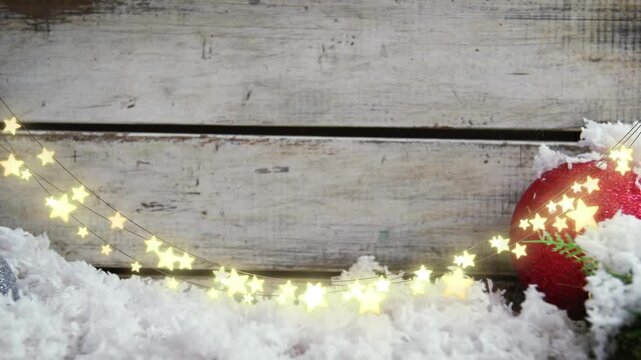 Animation of star string lights, snow and christmas bauble