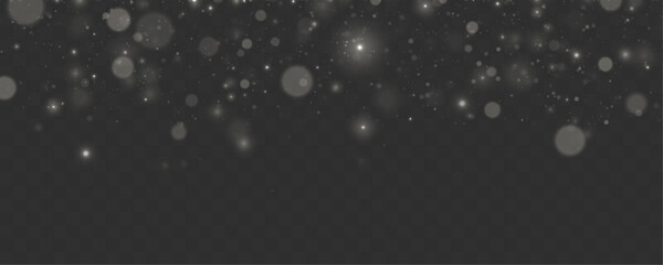 White glowing bokeh particles drift across transparent layer. Soft festive lights create elegant winter atmosphere. Ideal for modern design projects. © dedstock