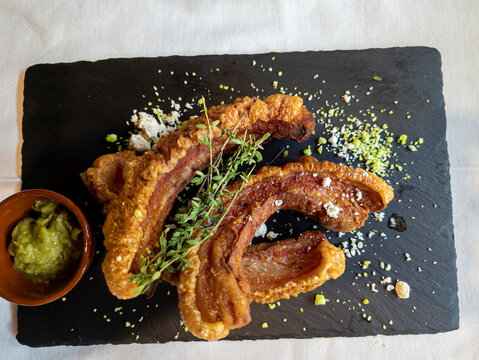 Gourmet, Typical Spanish dish called torreznos, consisting of deep-fried pork skin and savory fried crust