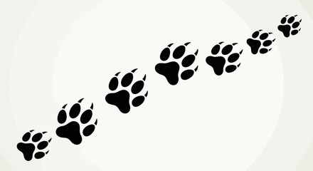 Black animal paw prints create a diagonal trail on a clean white background. © Keysa