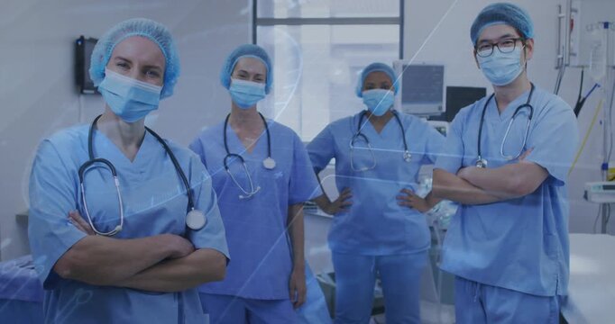 Medical team standing in OR, scrubs and masks, triangle sweeping across causing shifts for surgery