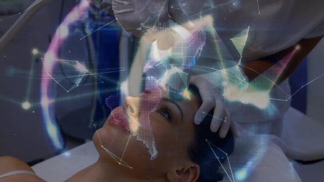 Tech holding patient and placing wand in clinic, causing digital mesh covering face to map skin