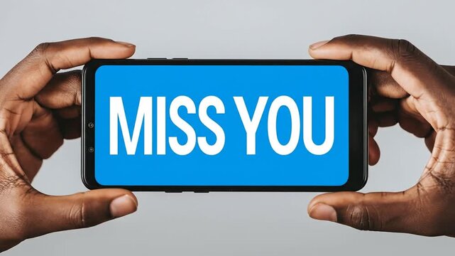 Two hands holding smartphone with Miss You text on screen closeup