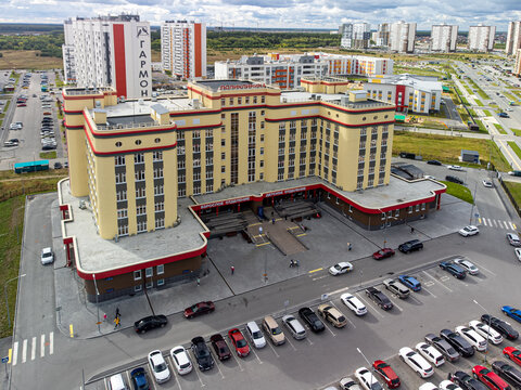 High-angle drone shot (top-down / bird's-eye view) of the main building of City Polyclinic No. 5 (GAUZ TO "Gorodskaya poliklinika No. 5") in Tyumen, Russia, captured on September 12, 2022, using a DJI