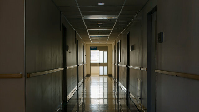 Dimly Lit Hospital Corridor with Reflective Floor