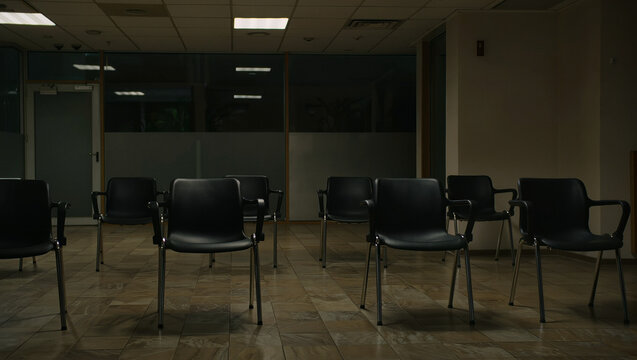 Empty Chairs in Dimly Lit Office Waiting Room
