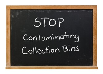 Fototapeta premium Stop contaminating collection bins written in white chalk on a black chalkboard in a wooden frame isolated on white