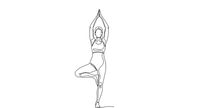 Woman in yoga tree pose standing.