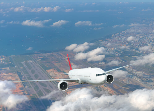 Airplane taking off from airport - Passenger airplane is flying over amazing mountains and sea  - Travel by air transport