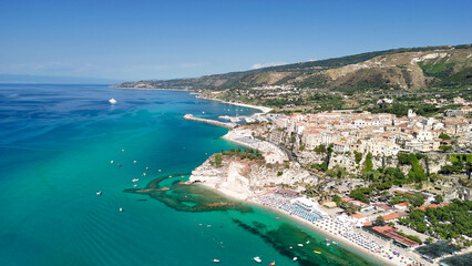 Naklejka premium Drone perspective of Tropea in summer showing turquoise sea and scenic coastal landscape