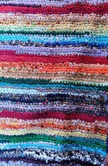 Obraz premium brightly colored hand-woven carpet, multicolored striped background