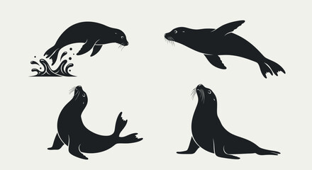 Set of four black silhouettes of seals in various poses. © Anggara