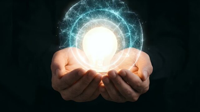 Hands holding glowing light bulb with digital neural network energy waves on dark background