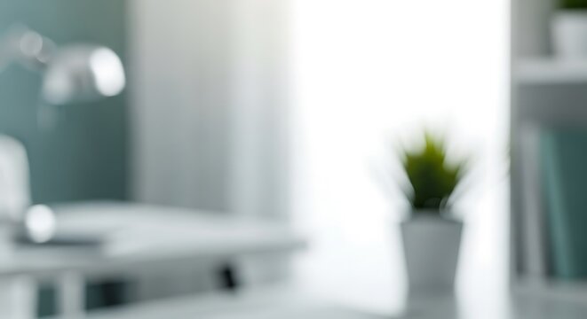 A blurry home office scene featuring a desk, a lamp, and a potted plant bathed in soft, natural light near a bright window