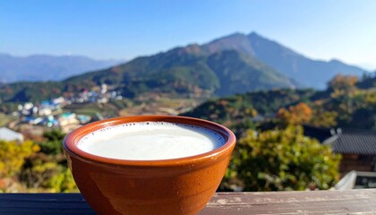 Naklejka premium Himalayan Lassi. Smooth yogurt drink in a clay cup, styled with a soft mountain backdrop.