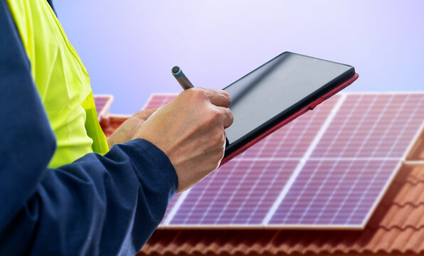 Solar panels,engineer installing solar panels and clean energy with digital tablet