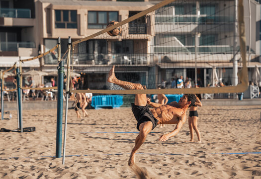 young man playing footvolley in Las Canteras beach. Las Palmas de Gran Canaria. Canary Islands. Spain.
