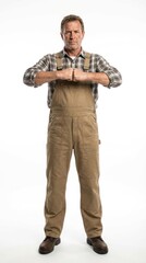 Naklejka premium Man in overalls, posing confidently with a serious expression.