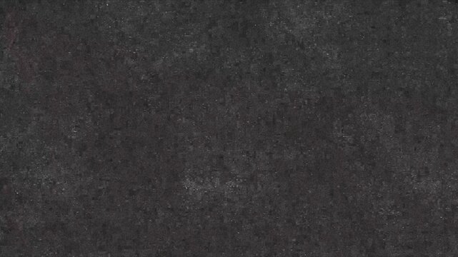 Solid dark gray to black visual with fine grainy texture throughout. Uniform appearance with subtle variations in tone, resembling paper fabric stone or digital noise. Minimalist design suitable for b