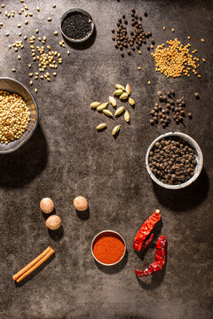 Raw vegetables on textured dark surface