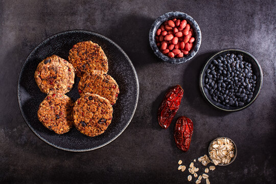 Raw vegetables on textured dark surface