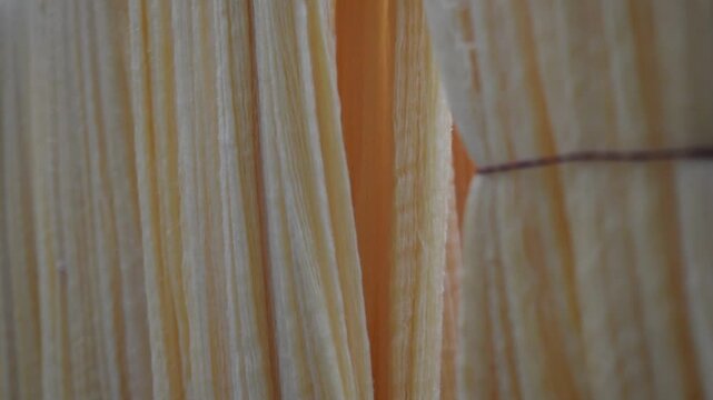 Cream colour Yarn Drying Under Sunlight in Traditional Textile Workshop, Fabric making Process in India