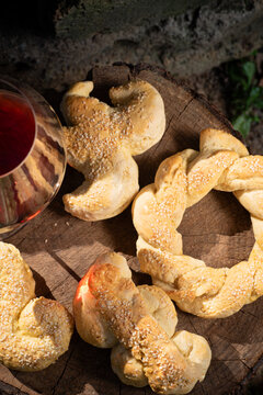 Traditional Sicilian sesame shaped bread with a glass of wine. Mafalda is a symbol of the city of&nbsp;Palermo 