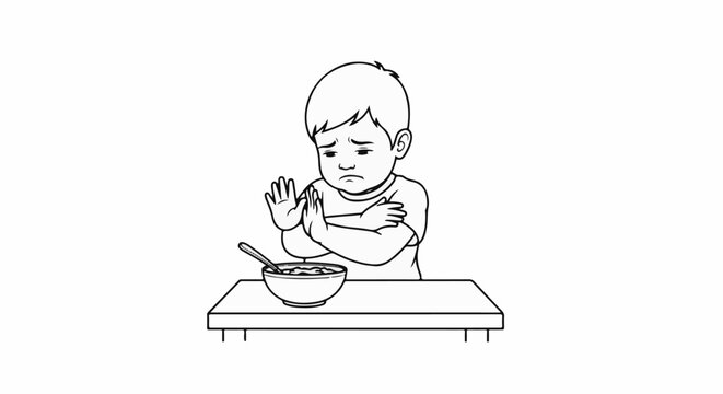 Sad child refuses to eat from bowl with spoon on table