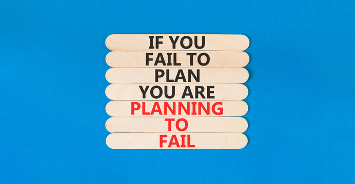 Planning to fail symbol. Concept words If you fail to plan you are planning to fail on beautiful wooden sticks. Beautiful blue paper background. Business planning to fail concept. Copy space.