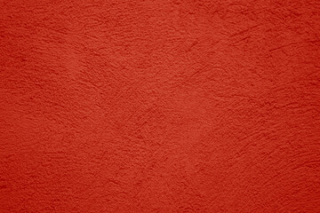 Fototapeta premium red scarlet plaster wall texture. Seamless surface abstract solid background Pale painted wall built structure textured stucco in terracotta color. seamless texture of plaster backdrop pattern