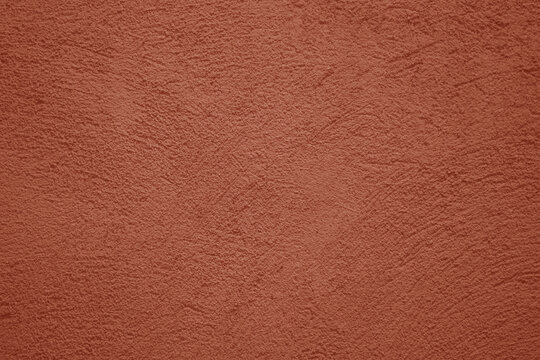 red pink plaster wall texture. Seamless surface abstract solid background Pale painted wall built structure textured stucco in terracotta color. seamless texture of plaster backdrop pattern Peach Fuzz