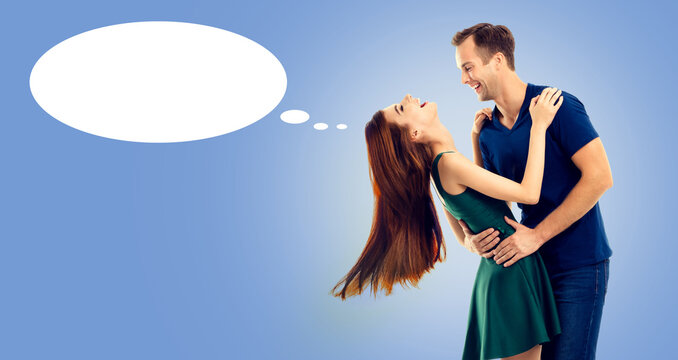 Love, dates, happiness, affection, romance, passion concept - happy hugs embrace or dance laugh couple man woman, look gaze at each other, isolated blue background. White mockup speech bubble