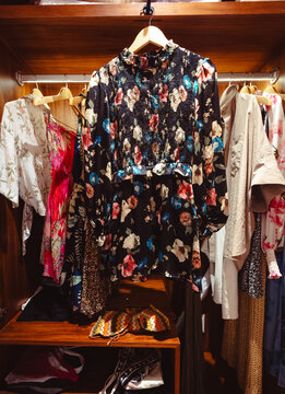 A close-up view of a wardrobe filled with floral and patterned clothing, accentuating the beauty of modern fashion and personal style in today&rsquo;s apparel landscape.