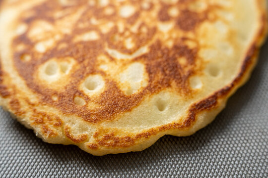 Pancakes cooking on griddle 