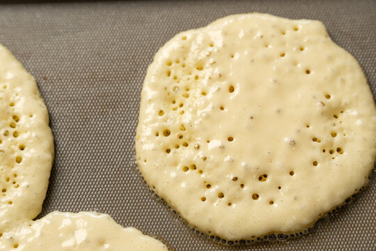 Pancakes cooking on griddle 