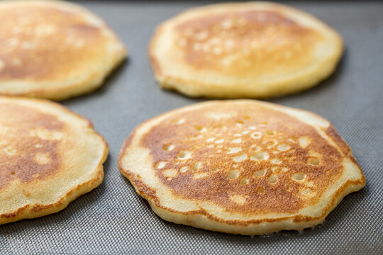 Pancakes cooking on griddle 