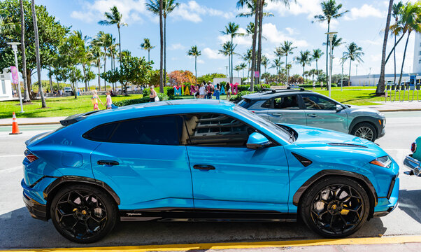 Miami, Florida, USA - February 15, 2025: 2024 Car of Lamborghini Urus parked outdoor, side view. Lamborghini Urus super SUV blue color. Luxury supercar Lamborghini Urus.