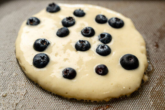 Pancakes cooking on griddle 