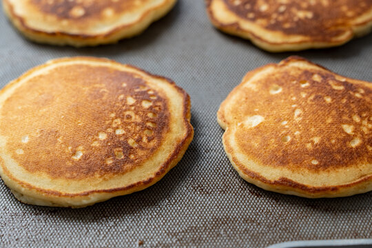 Pancakes cooking on griddle 