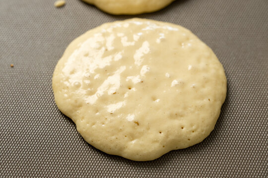 Pancakes cooking on griddle 